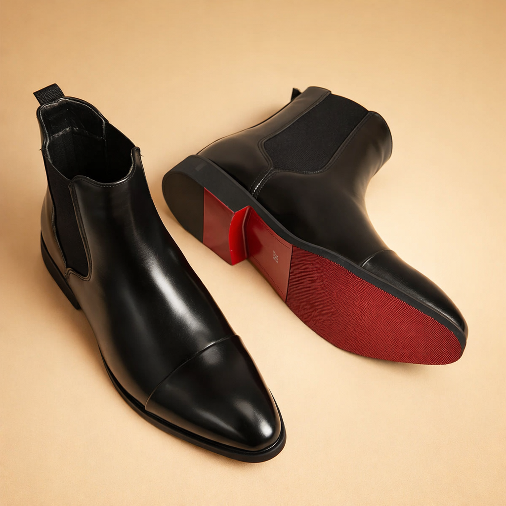 black-leather-chelsea-boots-studio-posed-editorial-front-sole-view.png