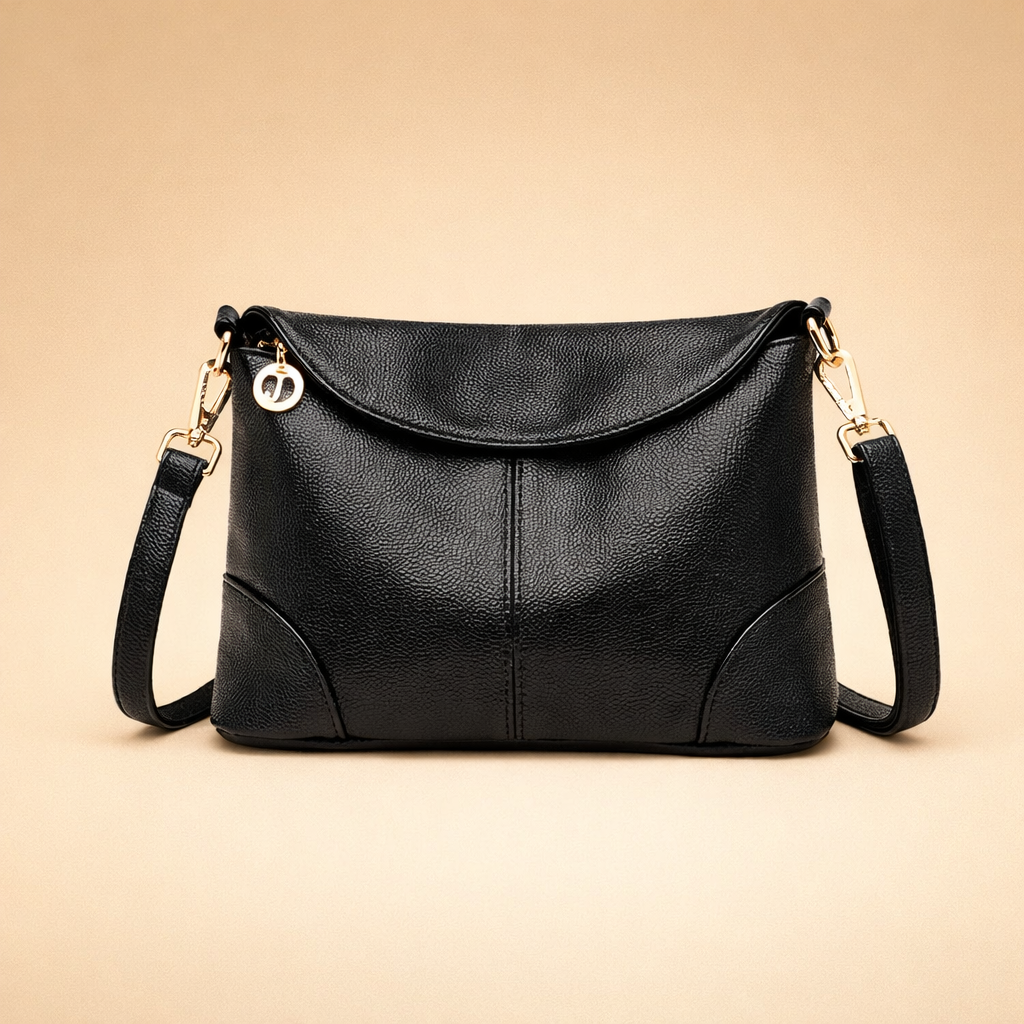 black-leather-crossbody-bag-elegant-studio-pose-european-fashion-shot.png