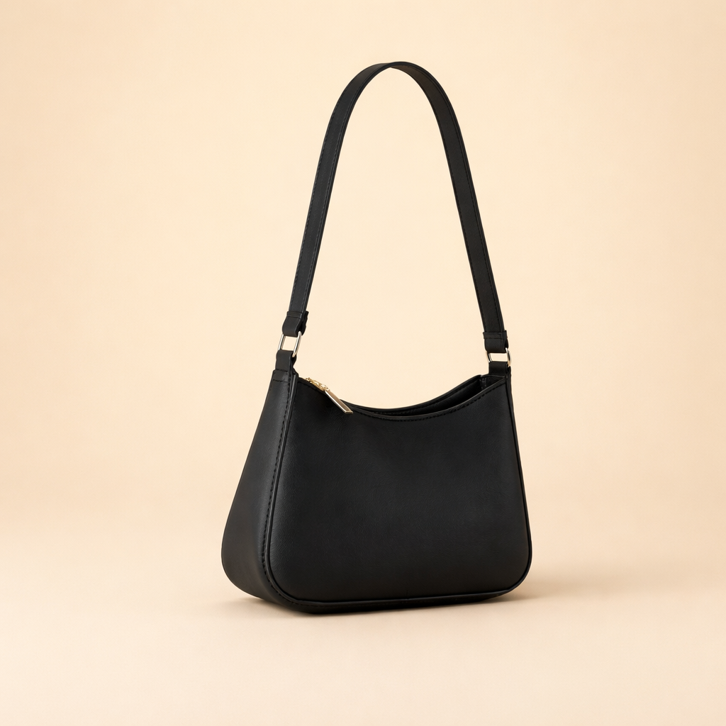 elegant-black-crescent-shoulder-bag-model-style-studio-pose.png