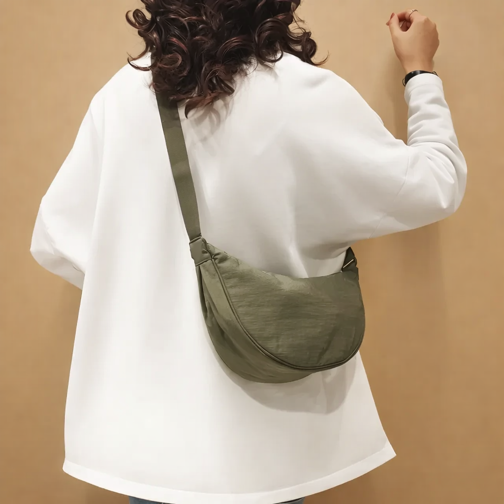 model-wearing-orange-crossbody-sling-bag-casual-streetwear-studio-shot_2.png